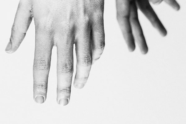 Two-hands-reaching-down-photography-style-by-Outsource-Marketing