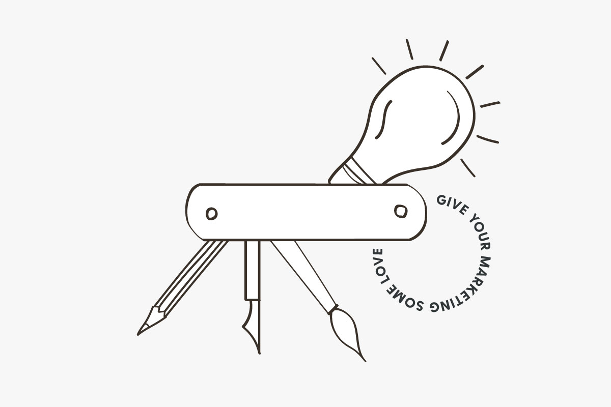 Light bulb and pens with text that says give your marketing some love