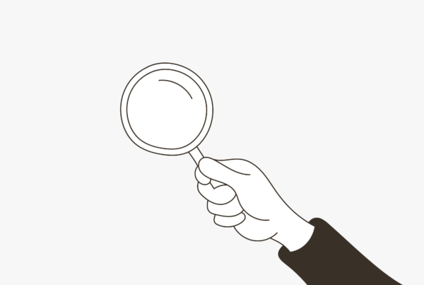 A drawing of a hand holding a magnifying glass on a blog about get to know your customers day